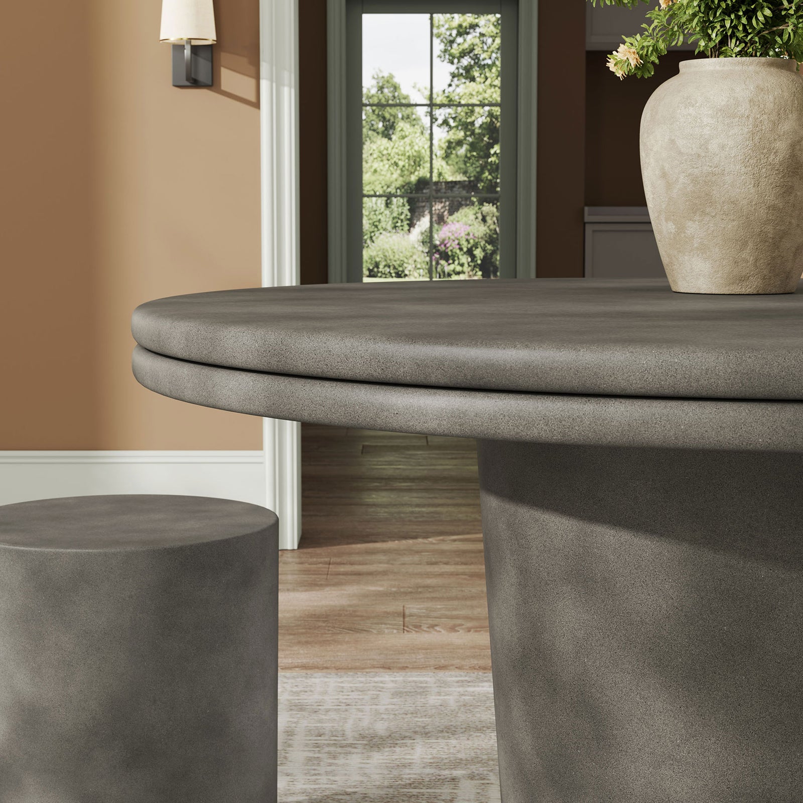 Gray concrete tabletop and pedestal base styled indoors, showcasing sleek finish and modern profile || EEI-7087-GRY || detail_room