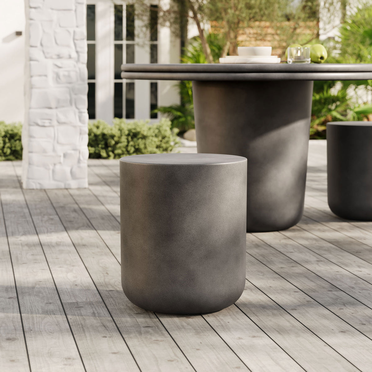 Gray concrete patio stool paired with a matching outdoor dining table for versatile extra seating || EEI-7088-GRY || front_angle_room