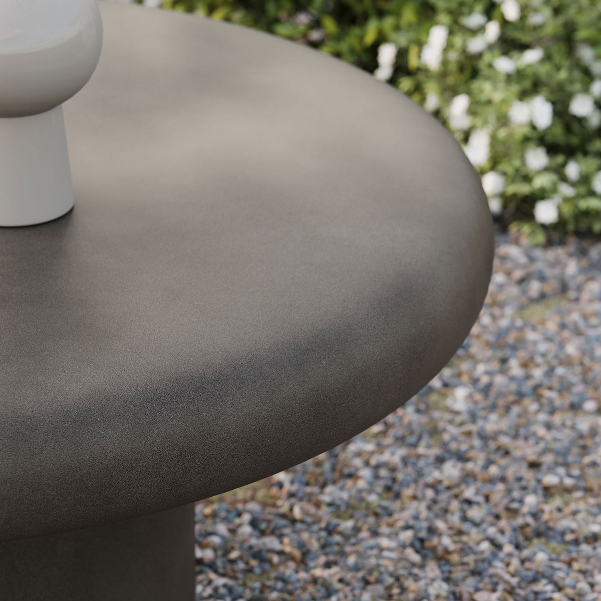 Gray concrete tabletop with subtle speckled finish bringing a modern stone look to outdoor lounging spaces || EEI-7092-GRY || detail_room