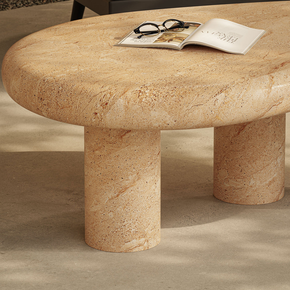 Textured faux travertine coffee table top brings organic warmth to an outdoor seating area with modern lines || EEI-7093-TRV || detail_room