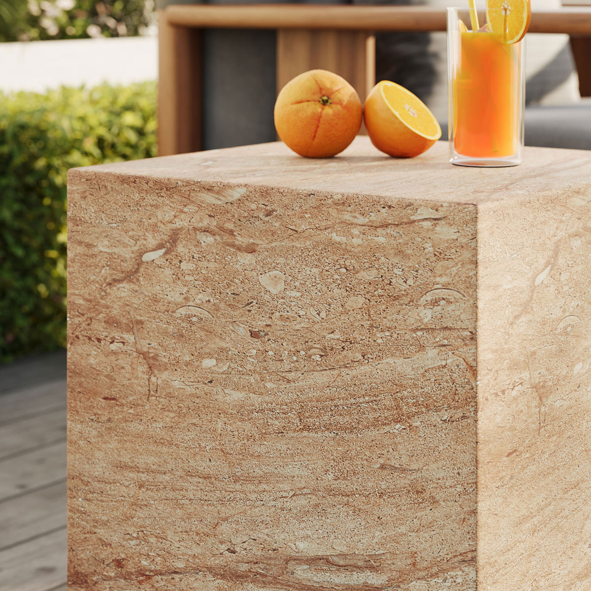 Travertine-look side table on a patio, perfect for setting down citrus drinks and small bites. || EEI-7096-TRV || detail_room
