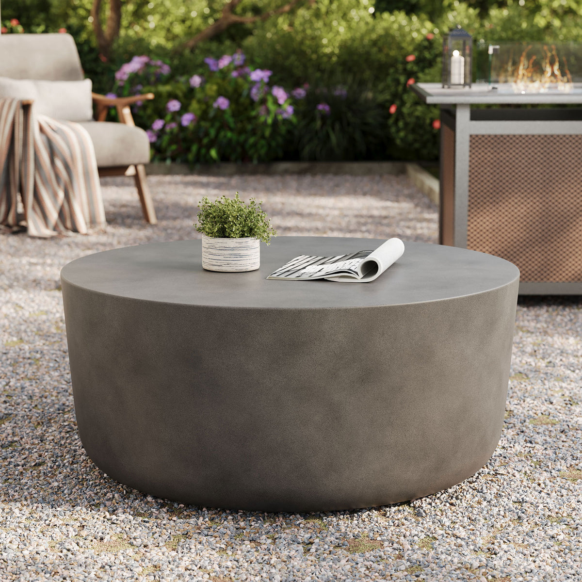 Outdoor patio scene featuring the gray concrete coffee table as a modern centerpiece for lounging || EEI-7099-GRY || front_angle_room