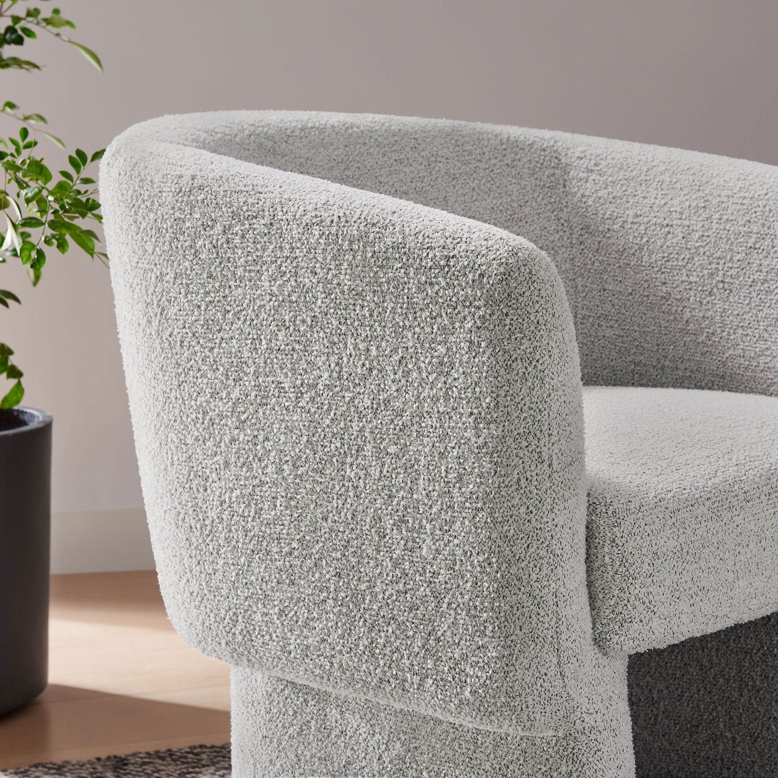 Textured boucle weave and gently rounded arm offer a tactile, cozy feel. || EEI-7100-NPT || detail_room