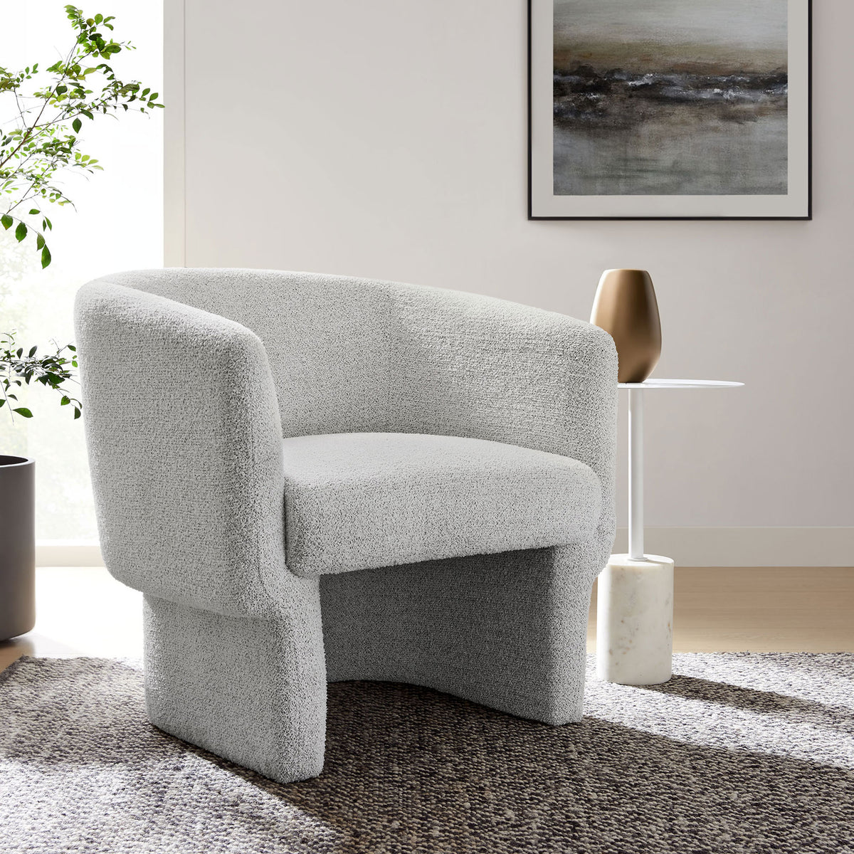 Barrel accent chair adds soft texture and modern warmth to living spaces with its boucle upholstery. || EEI-7100-NPT || front_angle_room