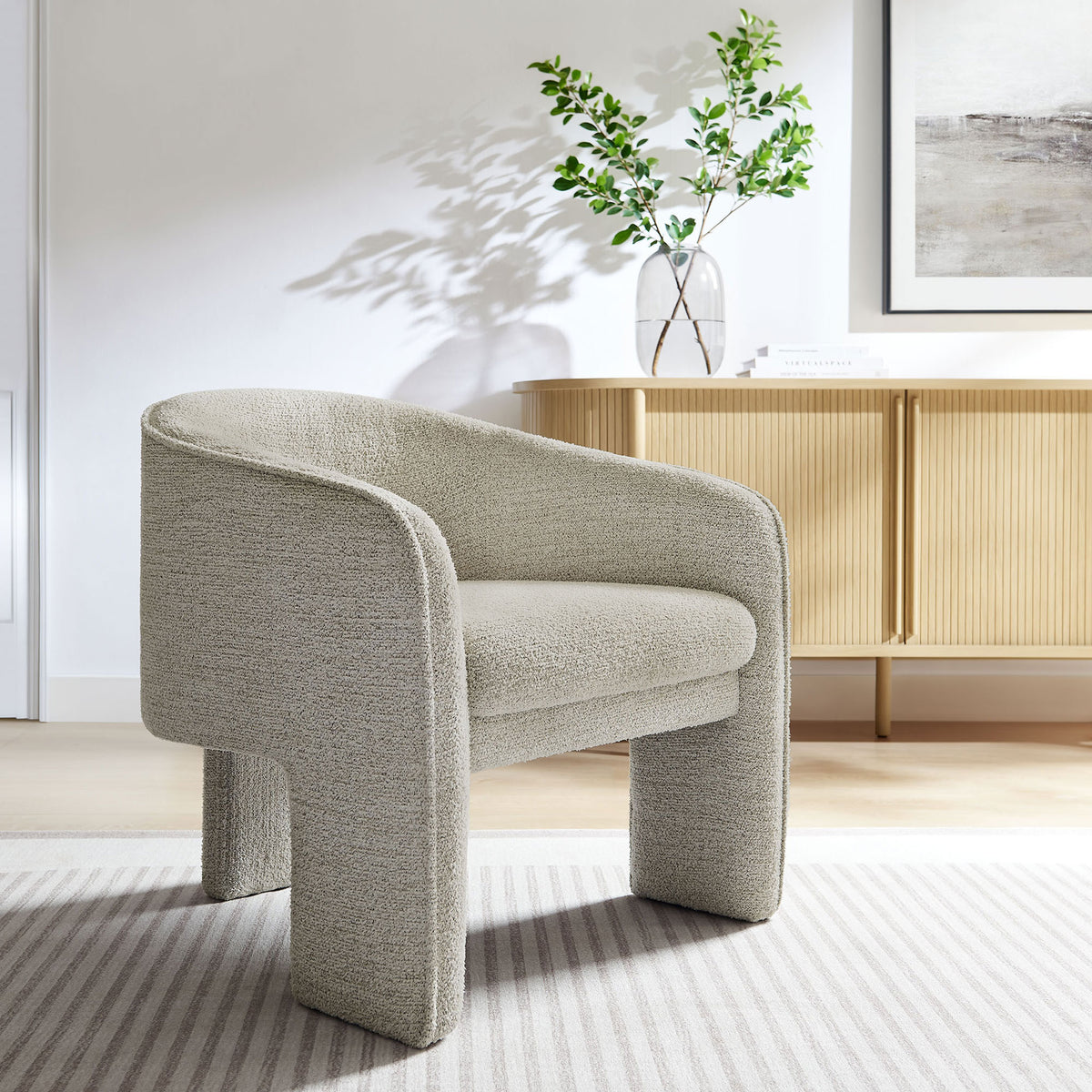 Statement barrel armchair in parchment boucle brings modern warmth to living spaces with a plush seat || EEI-7101-PCH || front_angle_room