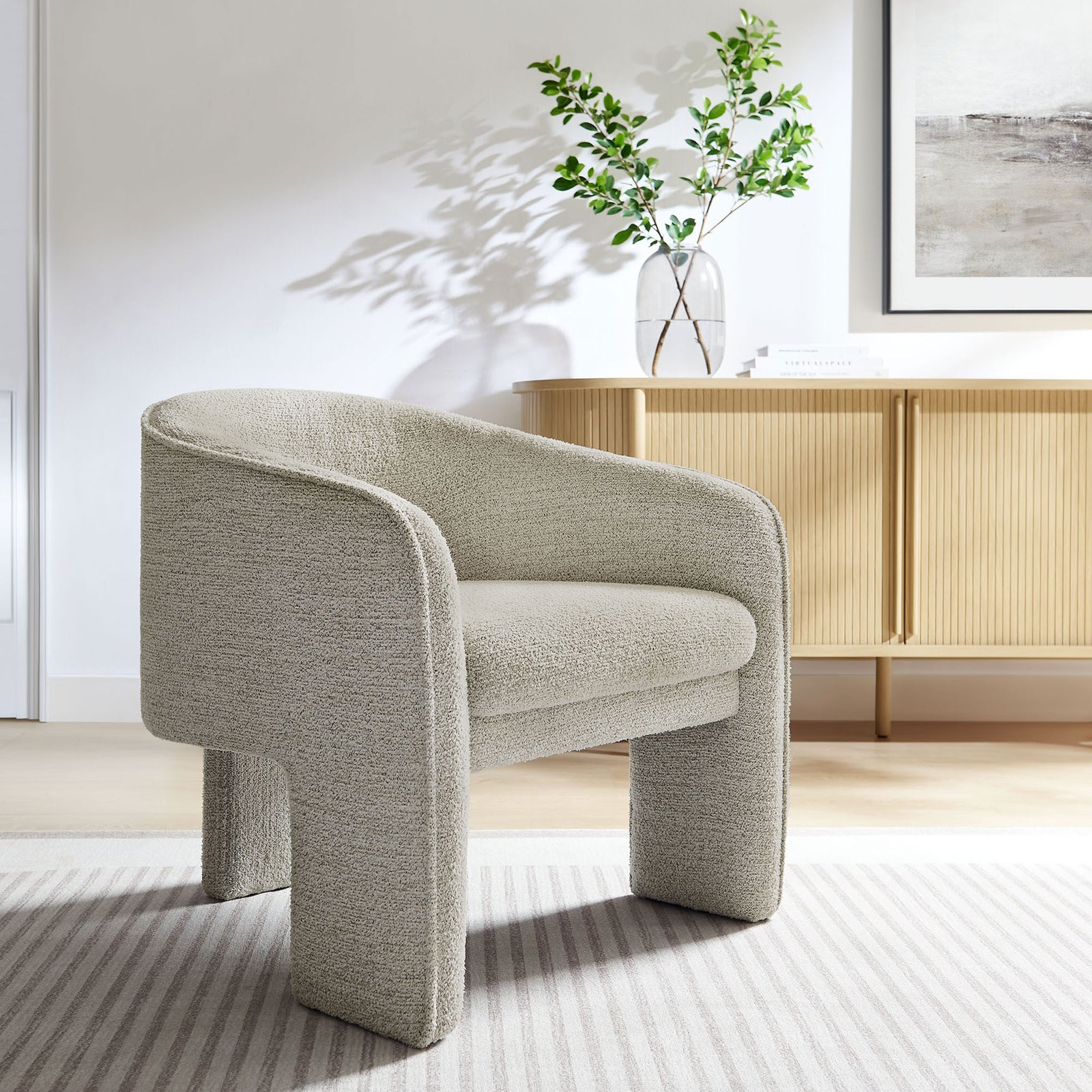 Statement barrel armchair in parchment boucle brings modern warmth to living spaces with a plush seat || EEI-7101-PCH || front_angle_room