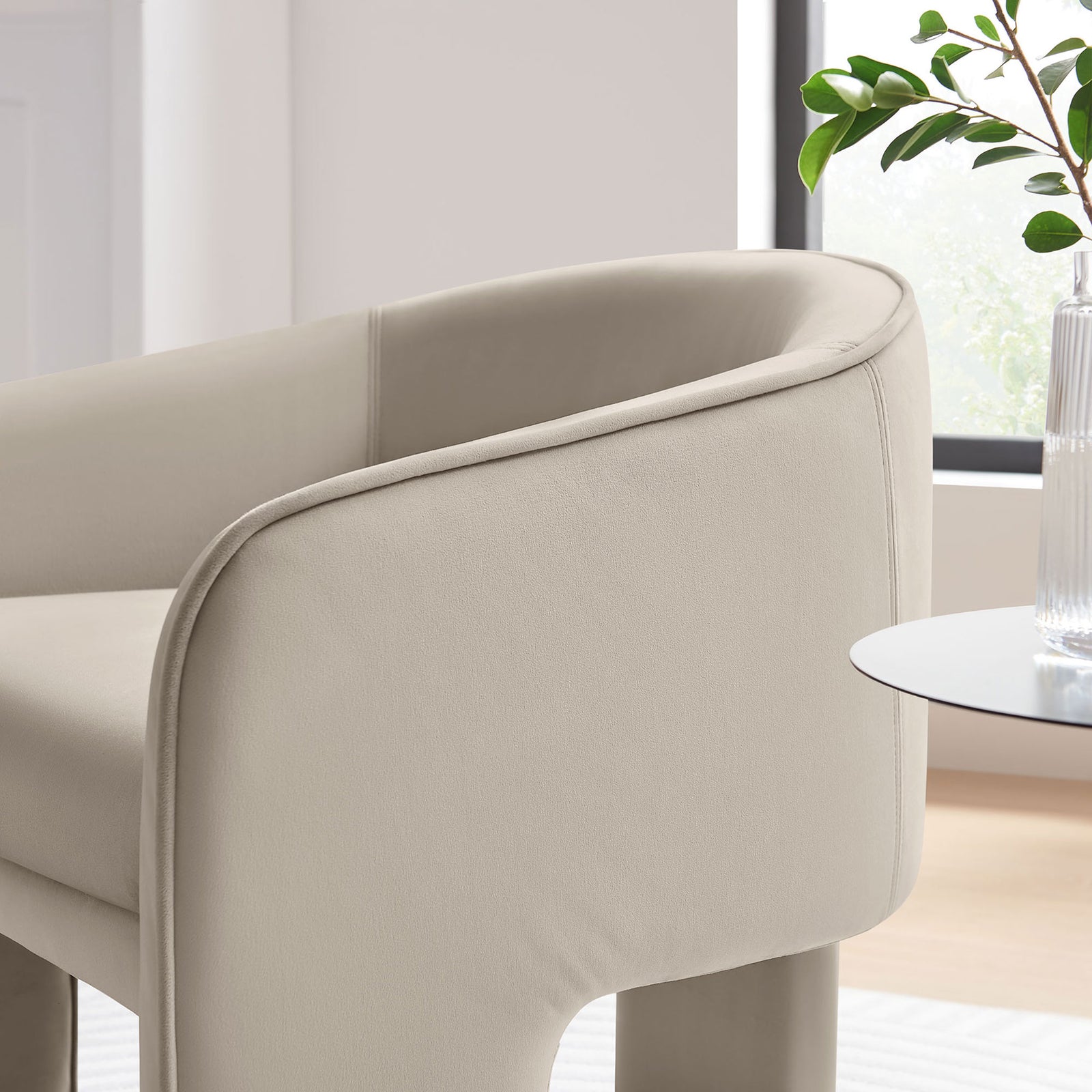 Soft velvet upholstery and rounded arm detail bring a refined, cozy touch to living spaces || EEI-7102-ALM || detail_room