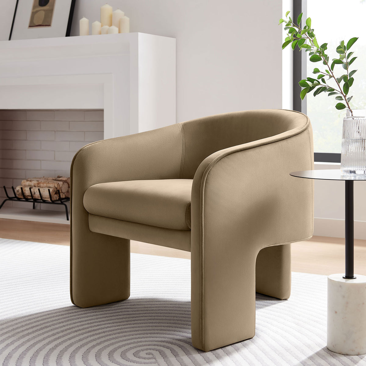Barrel-back taupe velvet chair brings sculptural curves and inviting cushioning to modern living spaces || EEI-7102-TAU || front_angle_room