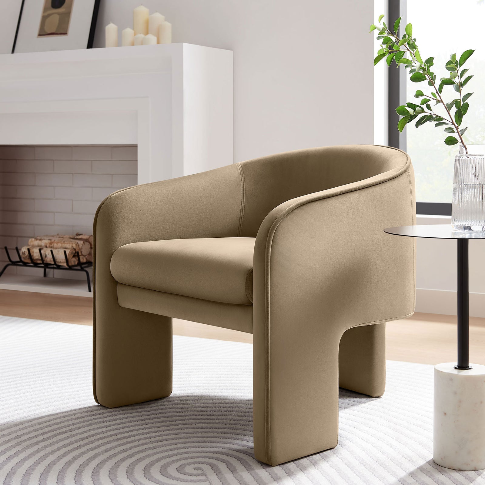 Barrel-back taupe velvet chair brings sculptural curves and inviting cushioning to modern living spaces || EEI-7102-TAU || front_angle_room