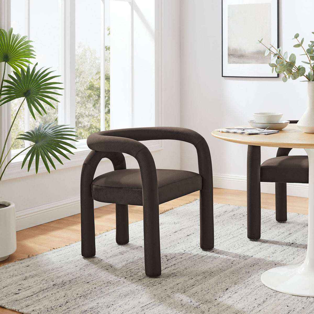 Astrid cocoa velvet dining chair styled in a modern dining room with round table and area rug || EEI-7104-COA || front_angle_room
