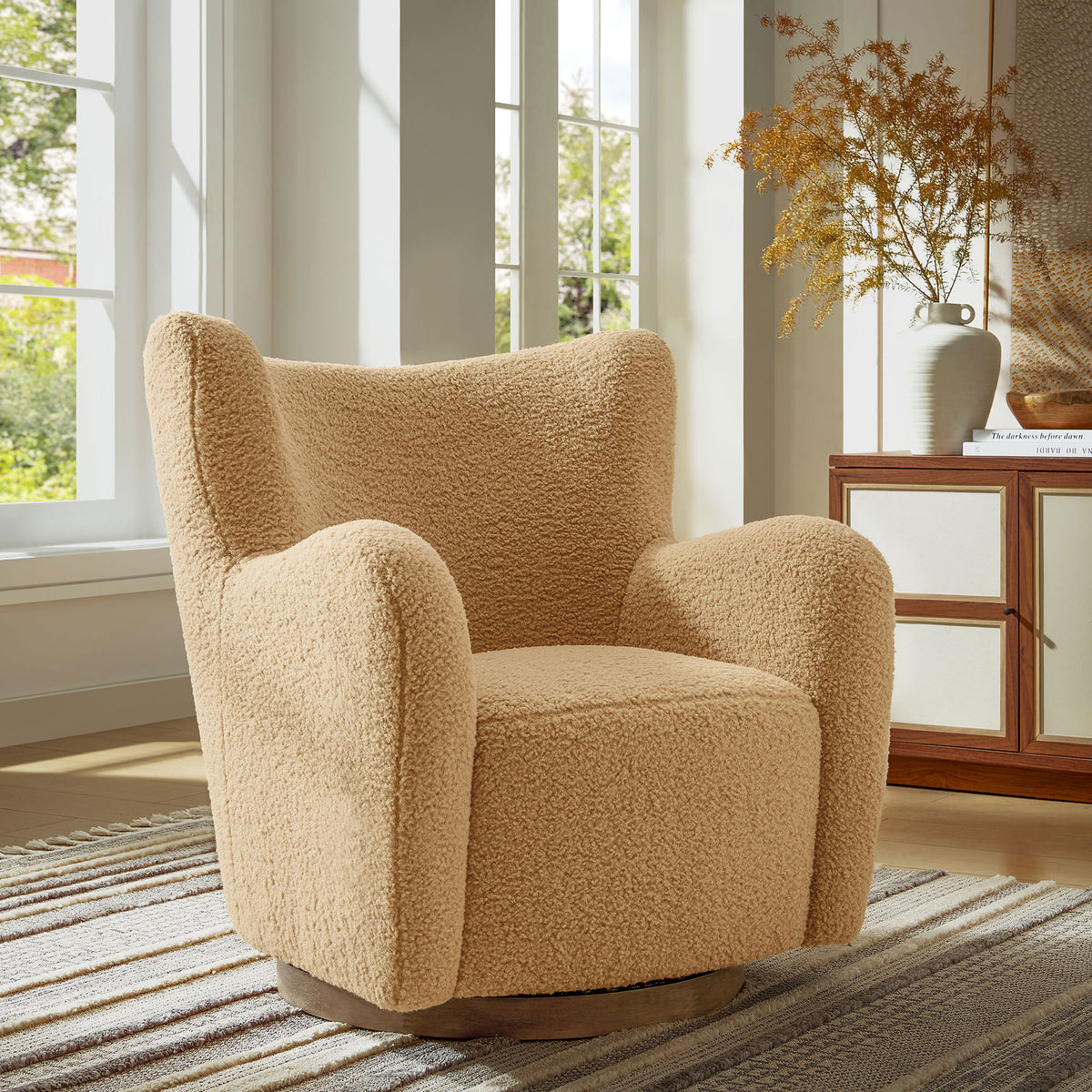 Inviting wingback swivel chair creates a plush focal point in any living room or reading nook || EEI-7105-CAM-WAL || front_angle_room