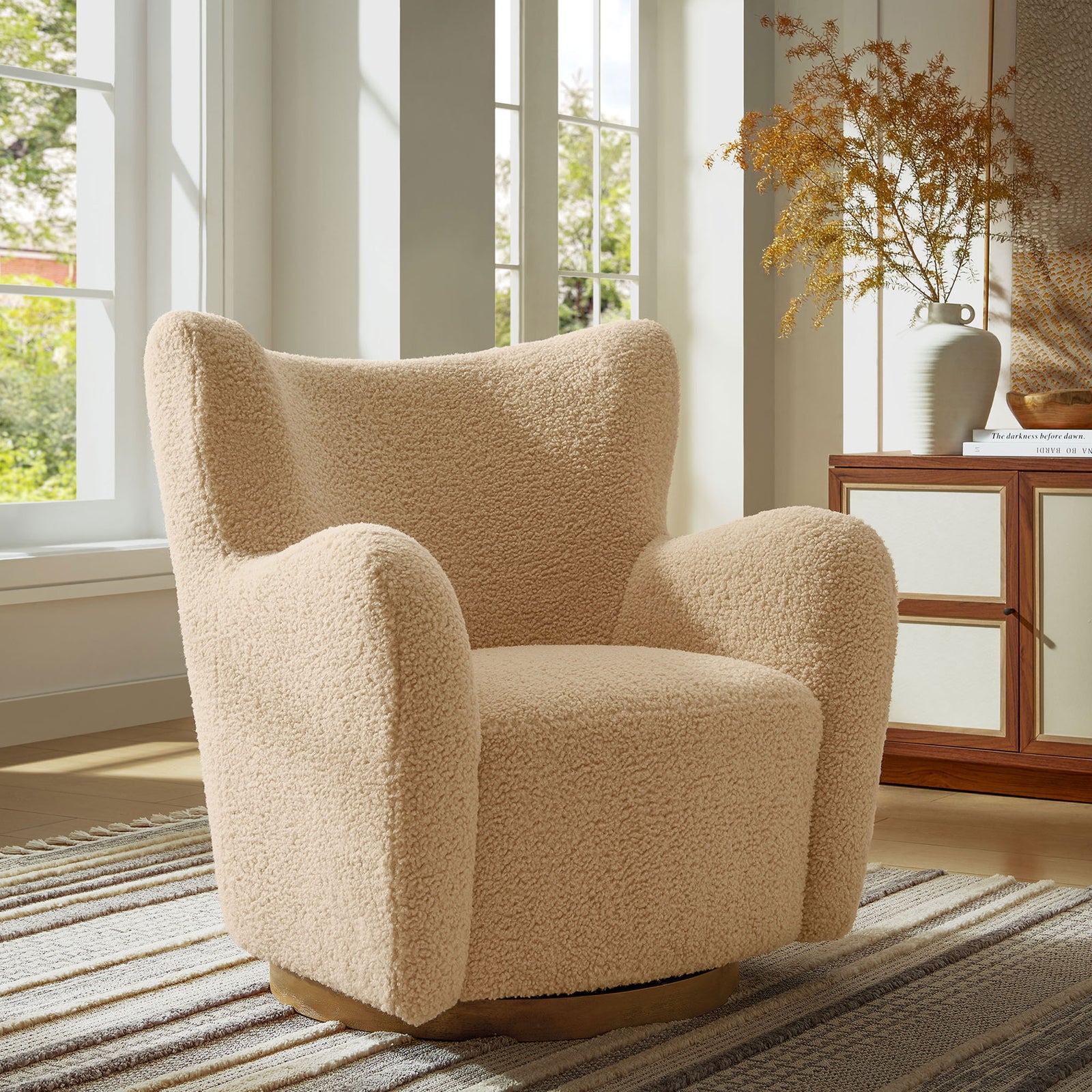 Ivory wingback swivel chair pairs plush comfort with a walnut base for a stylish reading nook. || EEI-7105-IVO-WAL || front_angle_room