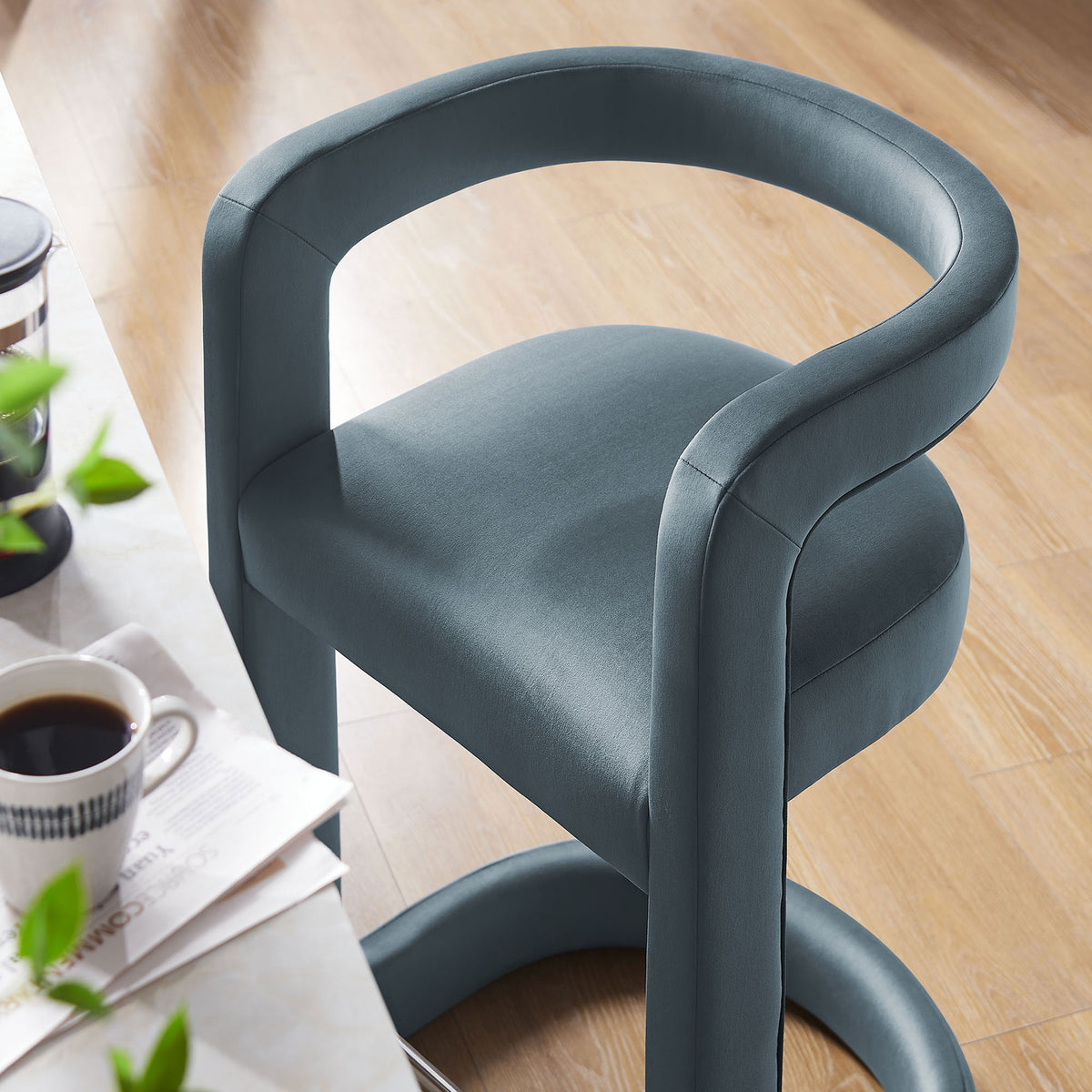 Cushioned seat and rounded back in cadet blue performance velvet at the counter || EEI-7107-CAB || detail_room