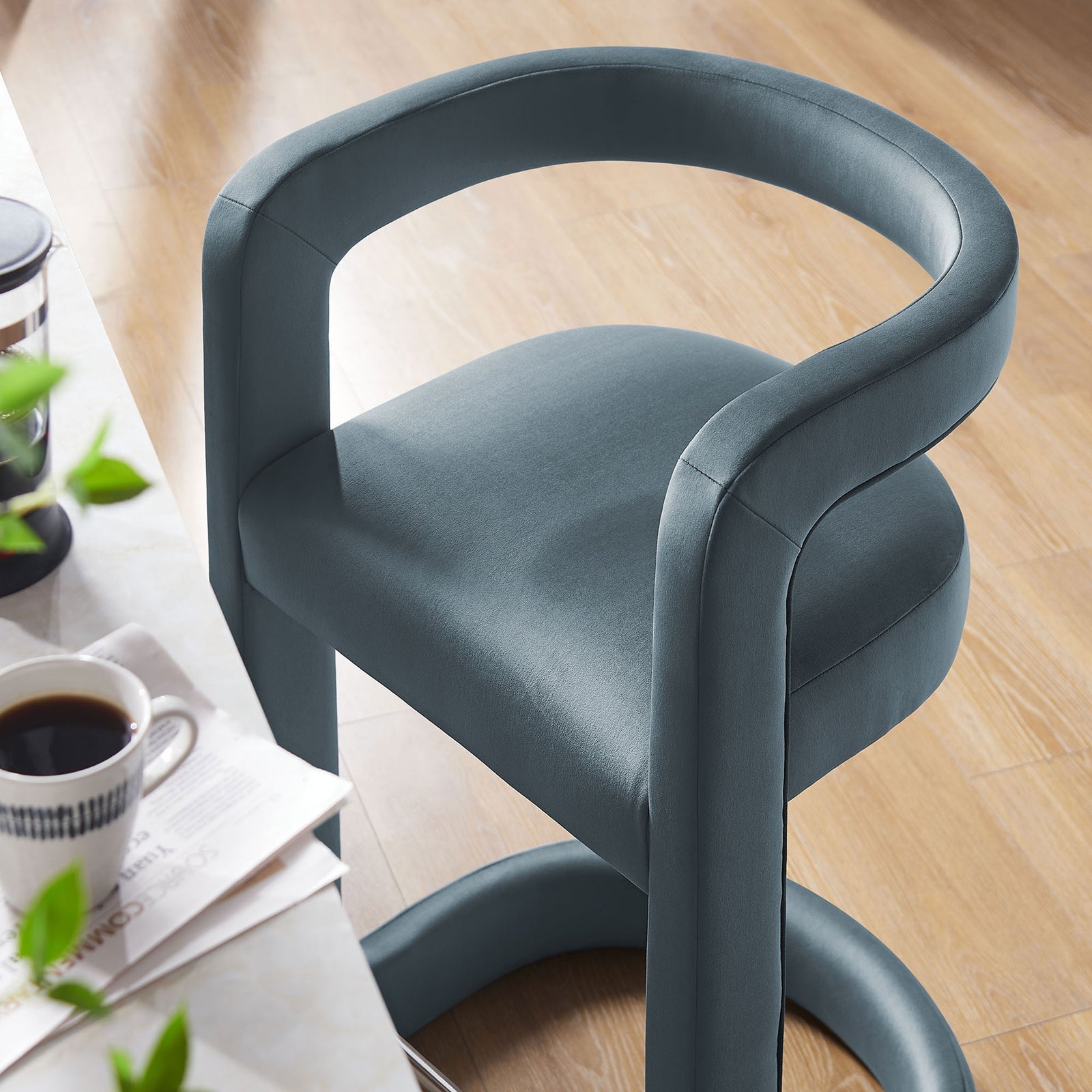 Cushioned seat and rounded back in cadet blue performance velvet at the counter || EEI-7107-CAB || detail_room