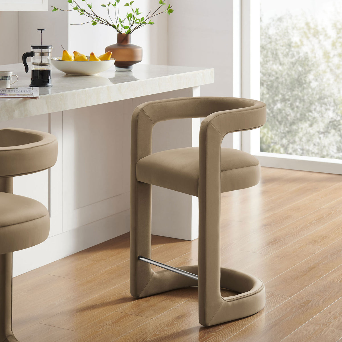 Elevate your kitchen with this taupe velvet counter stool and chic stainless steel footrest || EEI-7107-TAU || front_angle_room