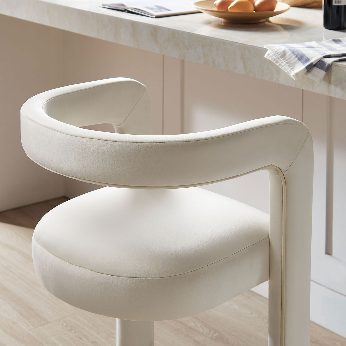 Soft-touch velvet and rounded armrest offer comfortable support at the bar || EEI-7108-ALA || detail_room