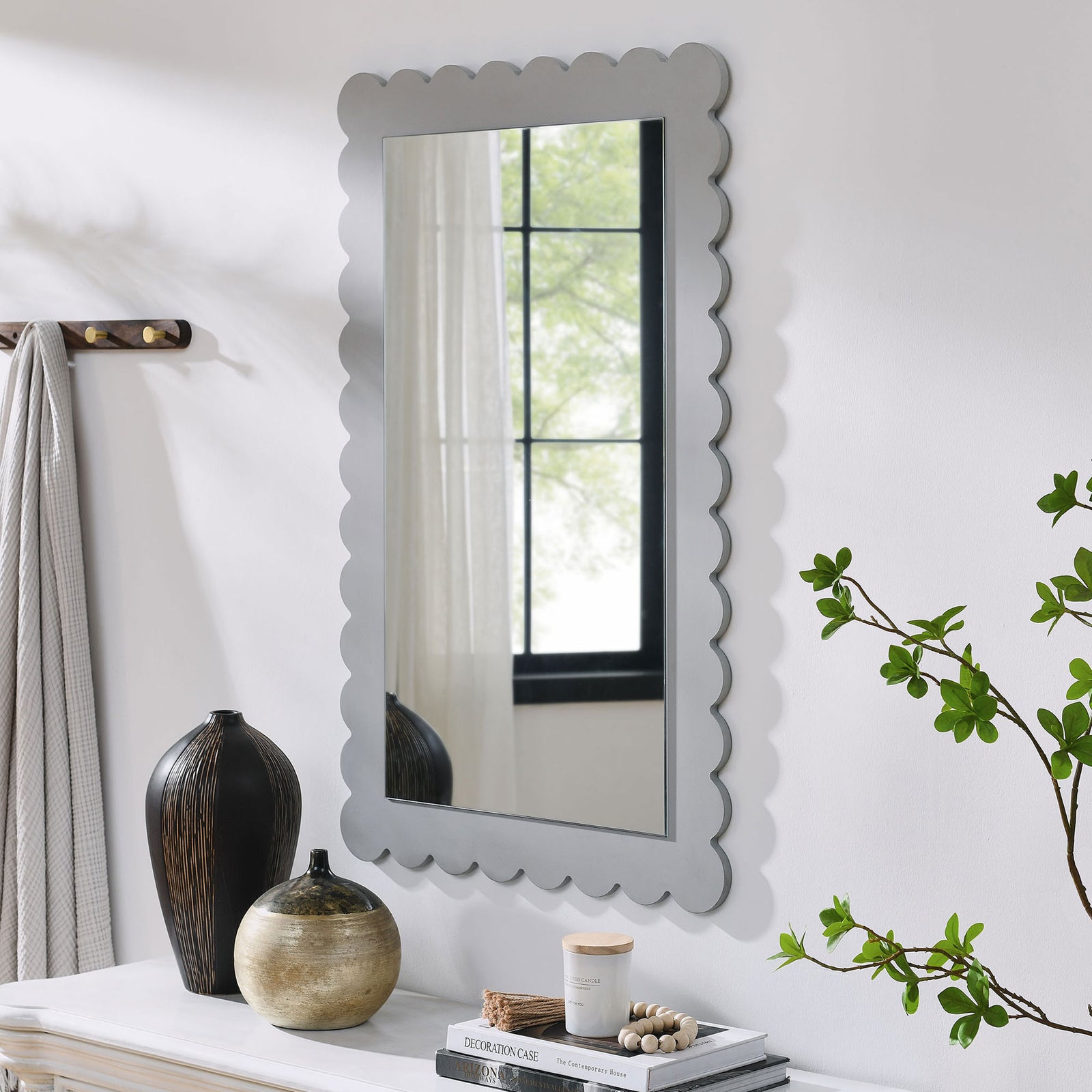 Light gray scalloped mirror styled above a console table for everyday entryway charm || EEI-7116-LGR || front_angle_room
