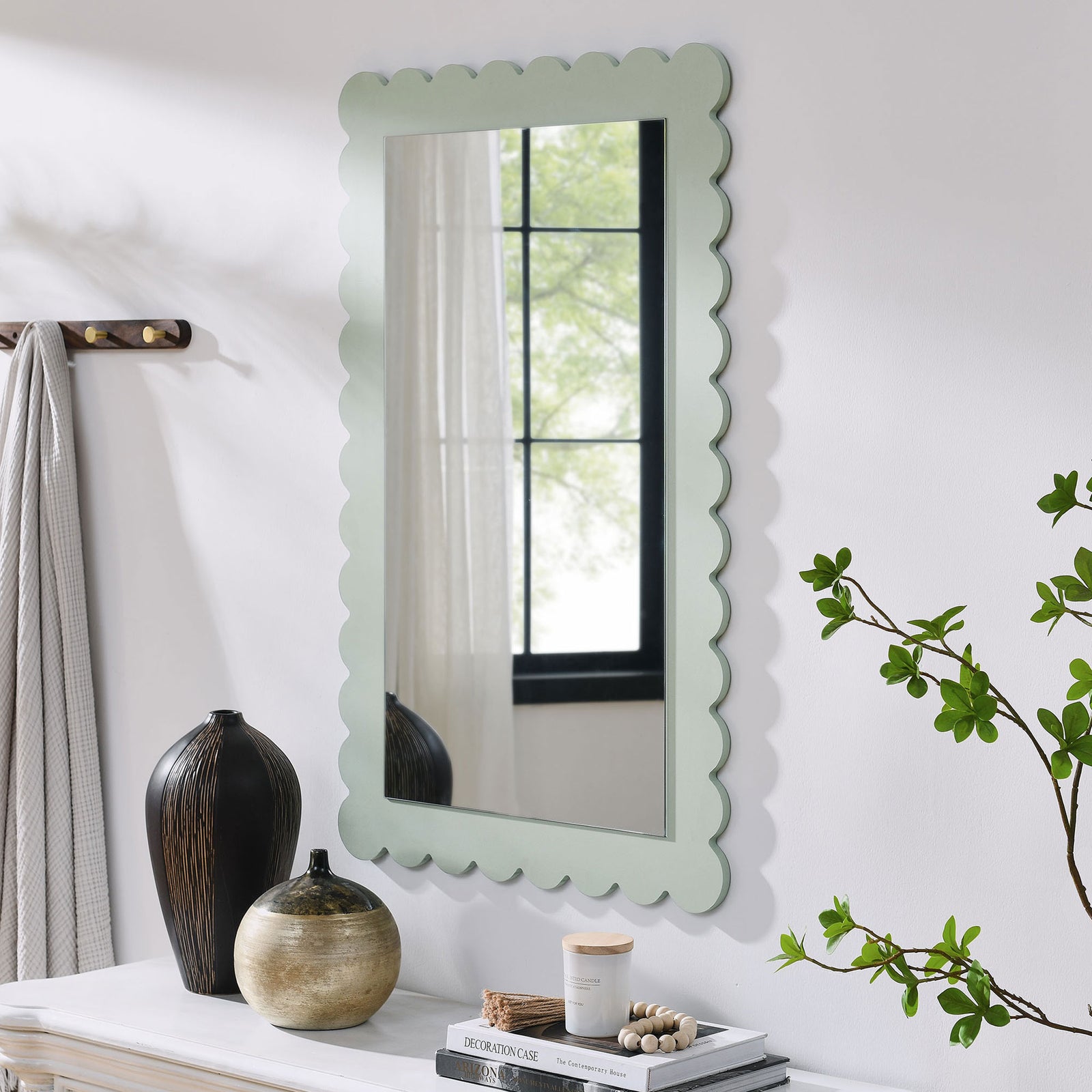 Sage green scalloped mirror styled above a console table for everyday entryway charm || EEI-7116-SGE || front_angle_room