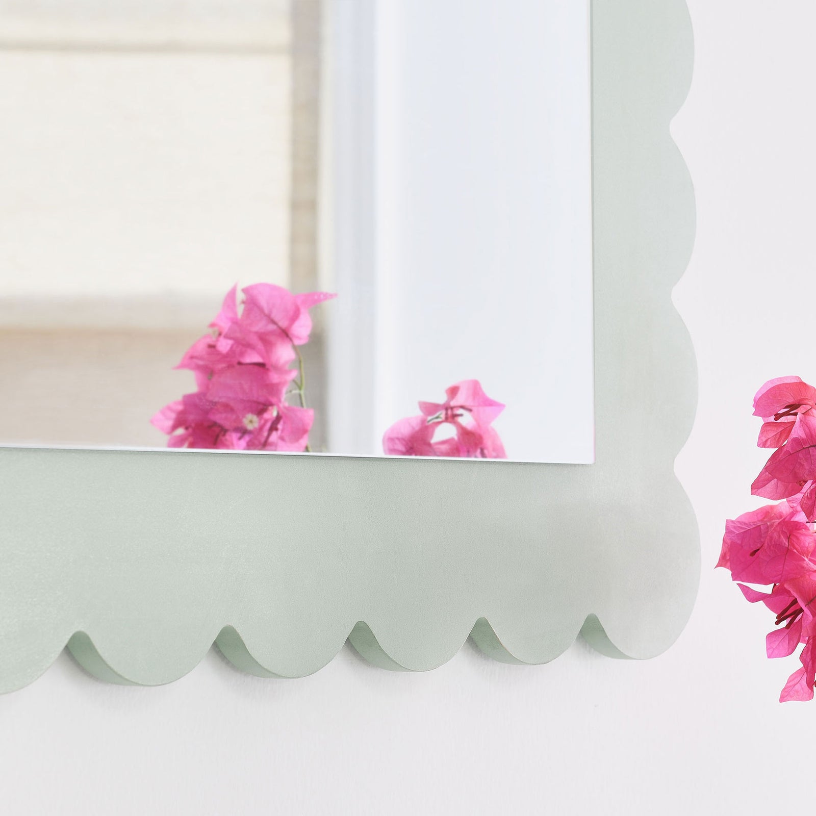 Detail of the sage green scalloped edge adding a whimsical touch beside bright flowers || EEI-7116-SGE || detail_room