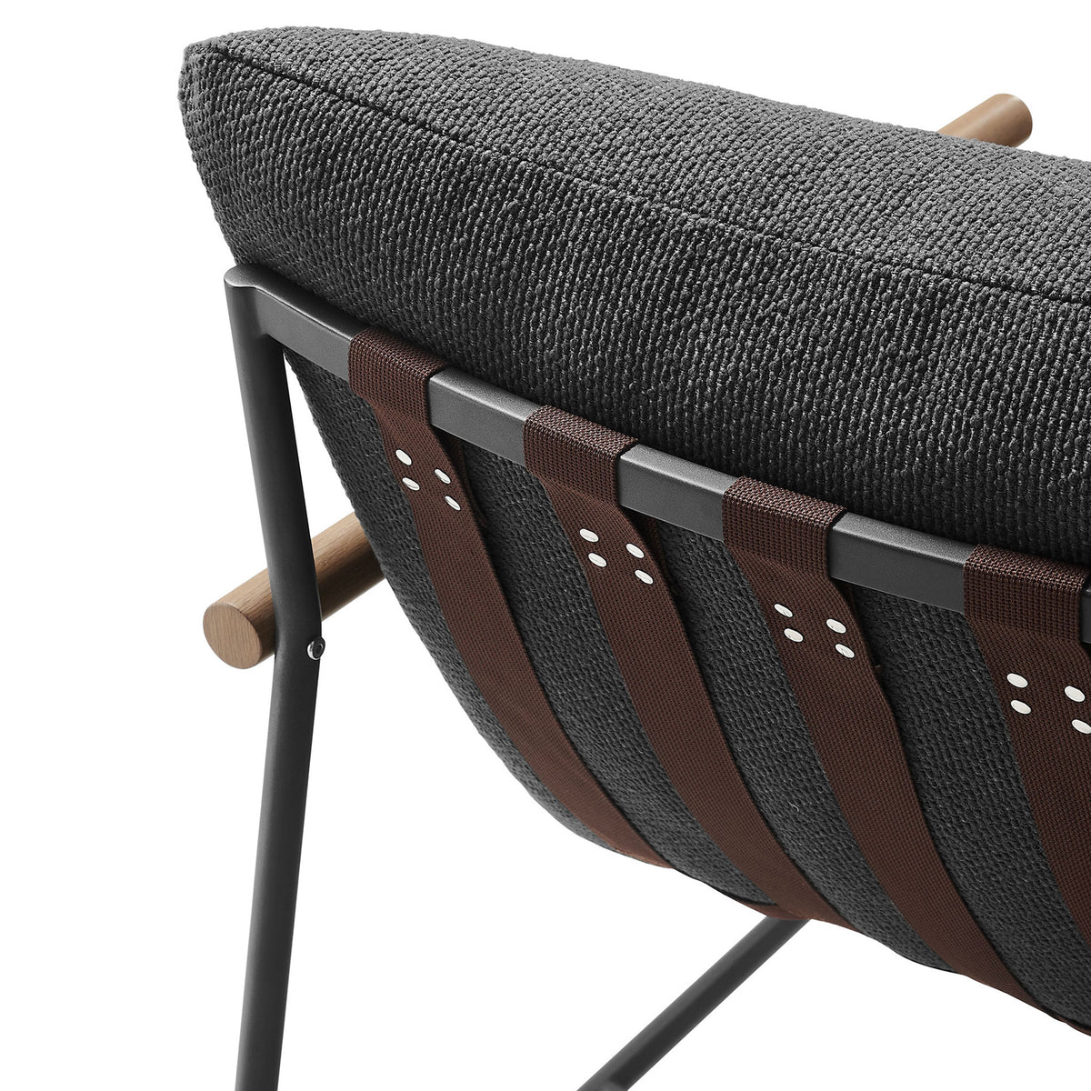 Charcoal boucle cushion paired with wide brown poly sling straps and black metal frame detailing || EEI-7118-CHA || detail_studio