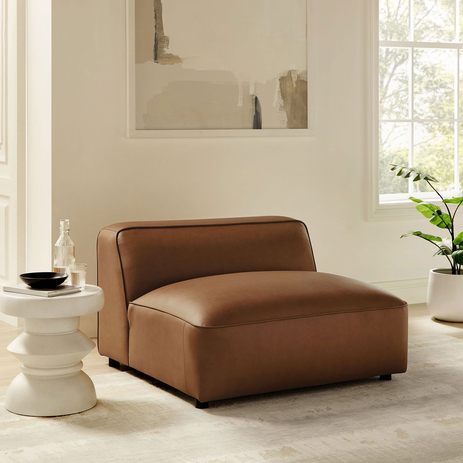 Modern armless modular chair anchors the room with warm coffee vegan leather and a deep, inviting seat || EEI-7121-COF || front_angle_room