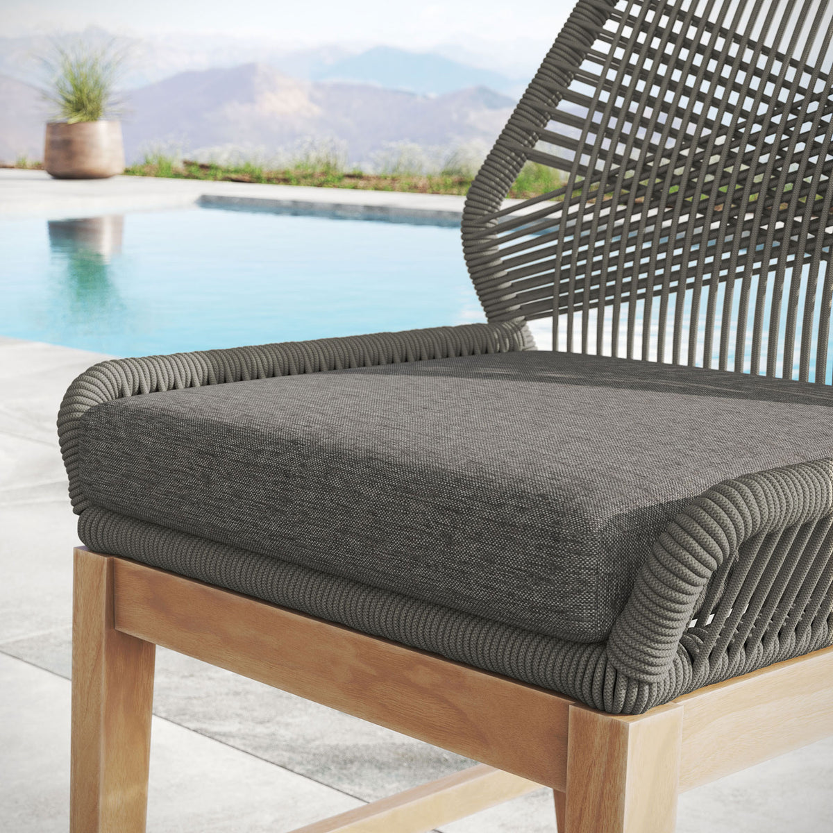 Cushioned counter stool seat with graphite rope frame shown in an upscale outdoor poolside setting. || EEI-7126-GRY-GPH || detail_room