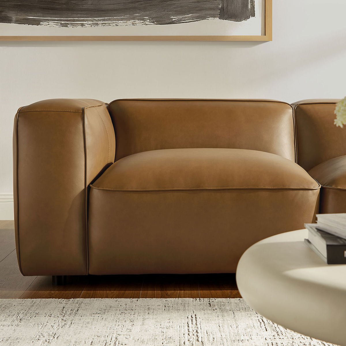 Plush camel vegan leather seat and arm with soft curves and tailored topstitching || EEI-7129-CAM || detail_room