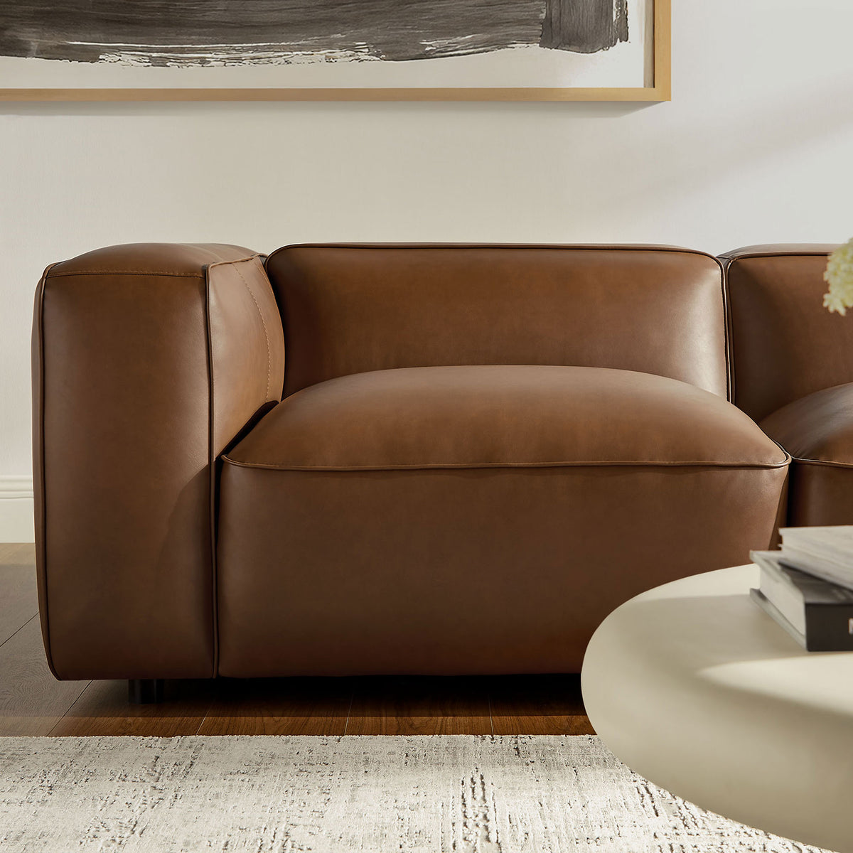 Single Auren modular seat in coffee vegan leather with generous cushioning and tailored seams || EEI-7129-COF || detail_room