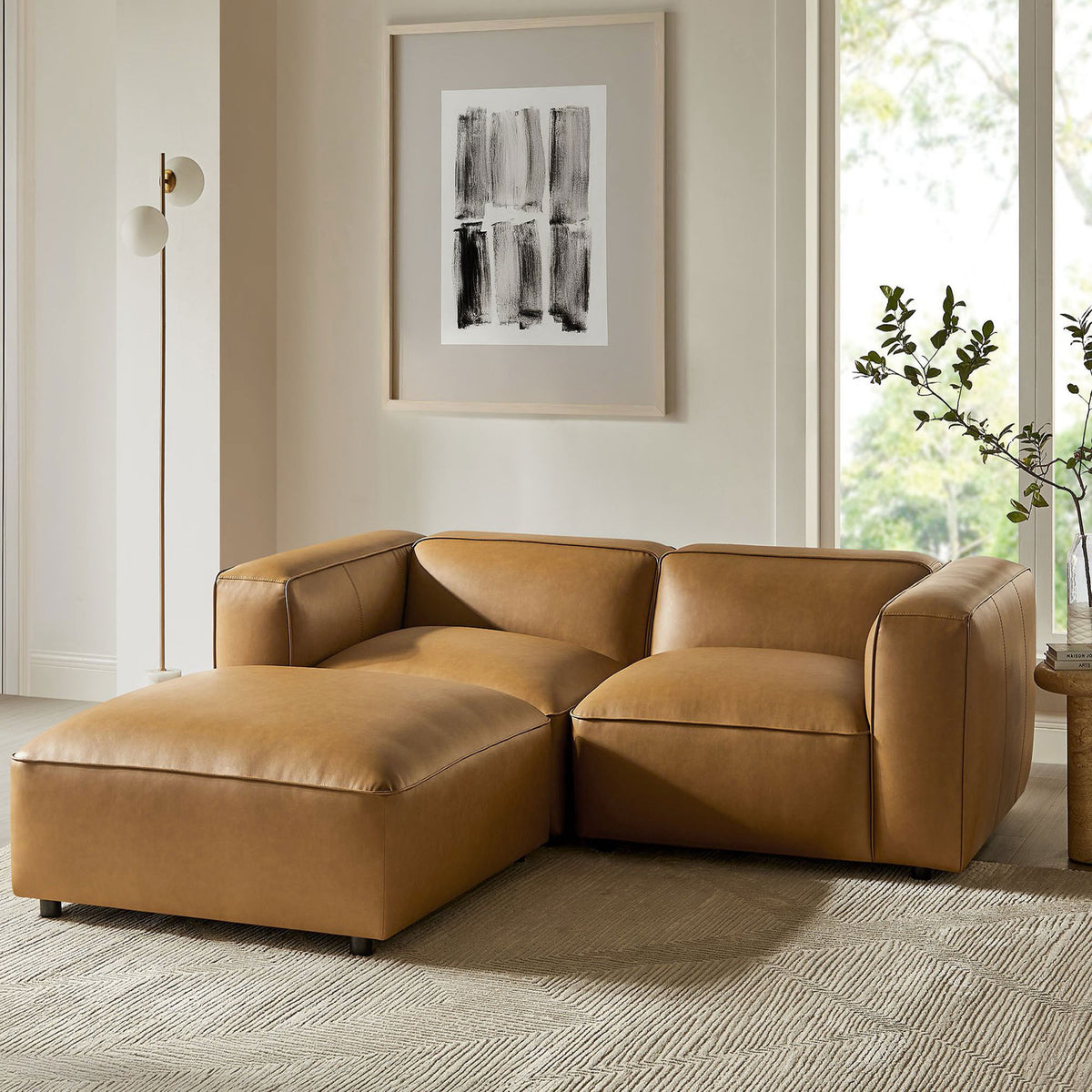 Camel modular loveseat with ottoman styled in a bright contemporary living room || EEI-7130-CAM || front_angle_room