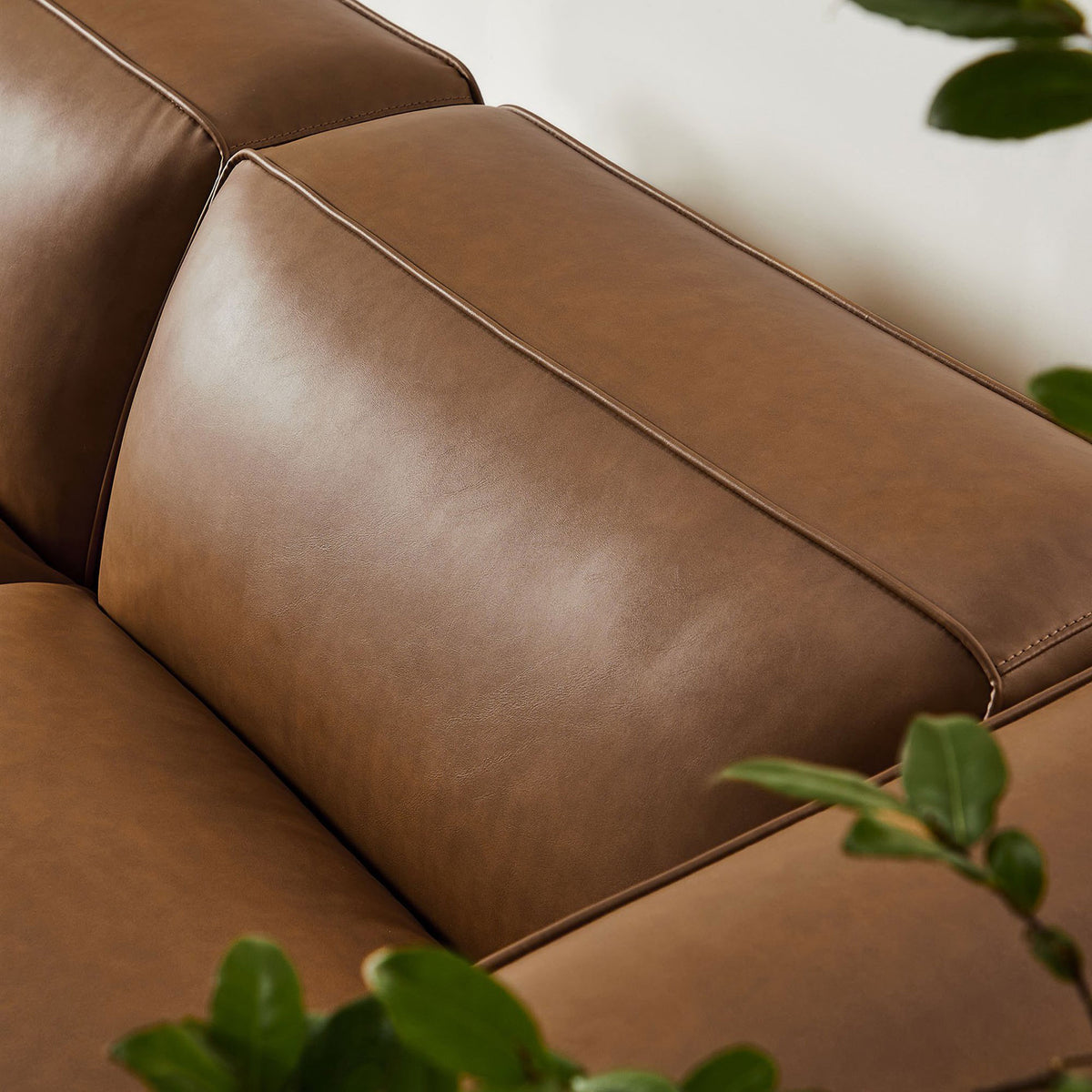 Plush coffee vegan leather seat and back cushion with tailored stitching for a refined modern look || EEI-7130-COF || detail_room