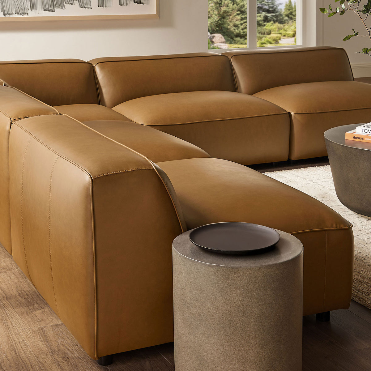 Low back camel vegan leather sectional highlights generous seat depth and tailored channel stitching || EEI-7133-CAM || detail_room