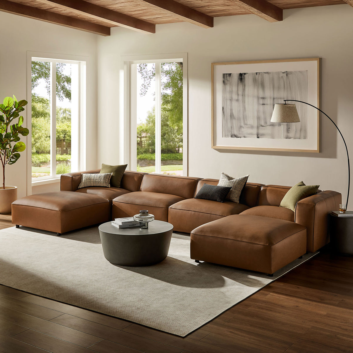 Coffee vegan leather modular sectional arranged in a spacious living room with modern decor || EEI-7134-COF || front_angle_room