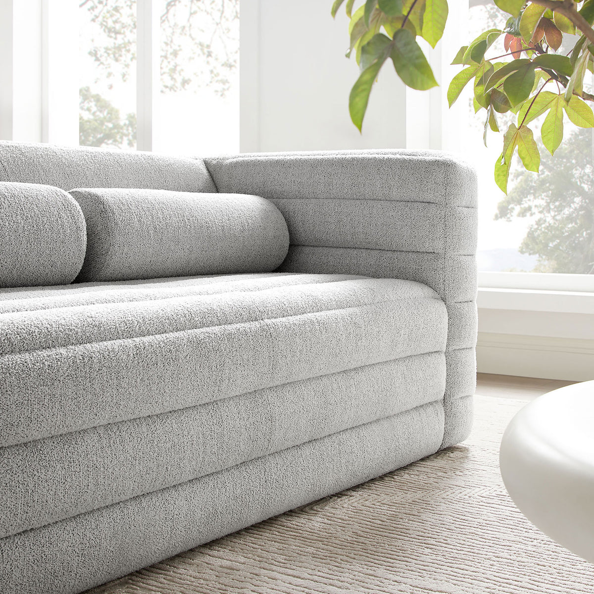 Relle boucle loveseat styled in a bright living space, adding soft texture and relaxed modern warmth. || EEI-7137-NPT || detail_room