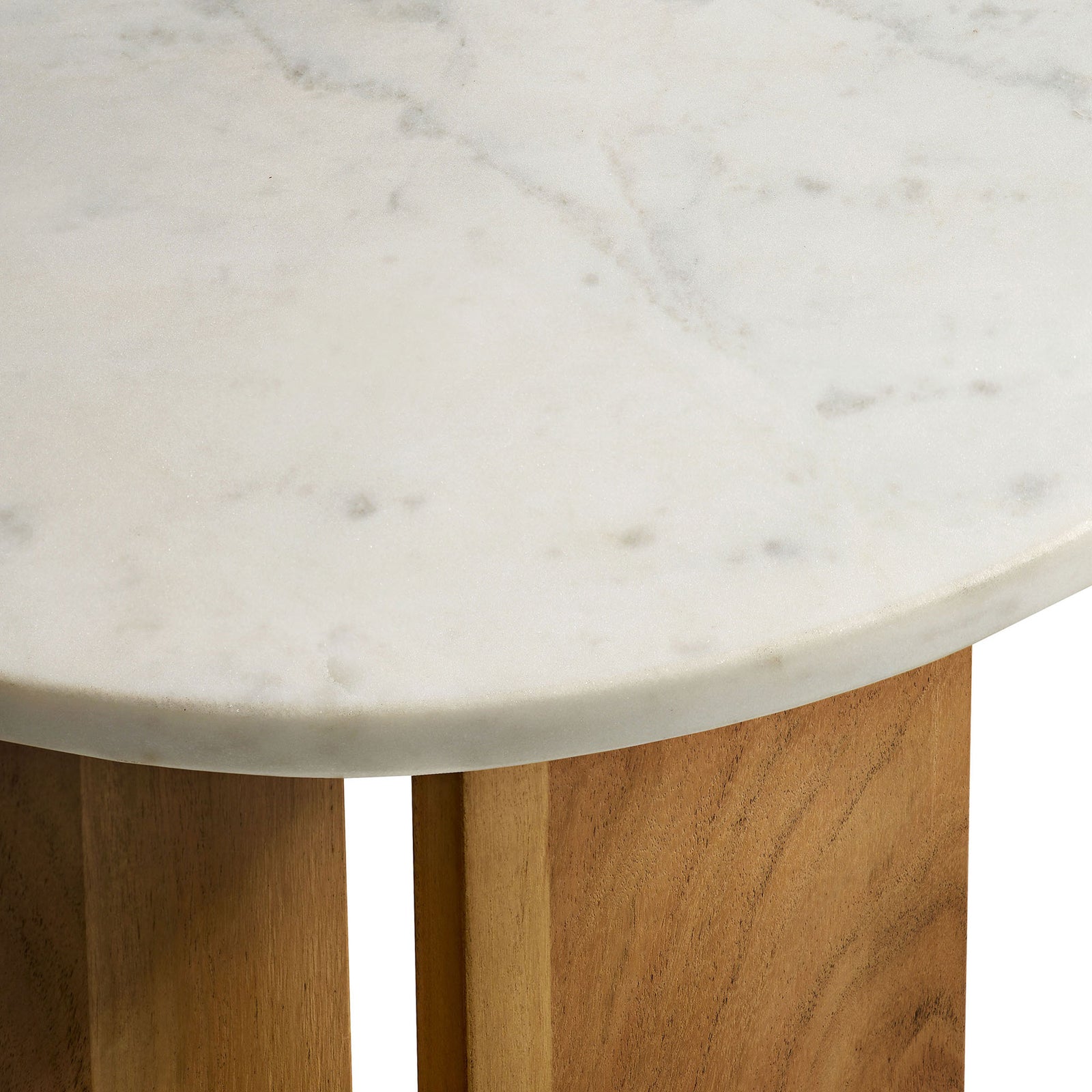 Close-up of the smooth marble surface and rounded edge detail of the tabletop || EEI-7141-NAT || detail_studio