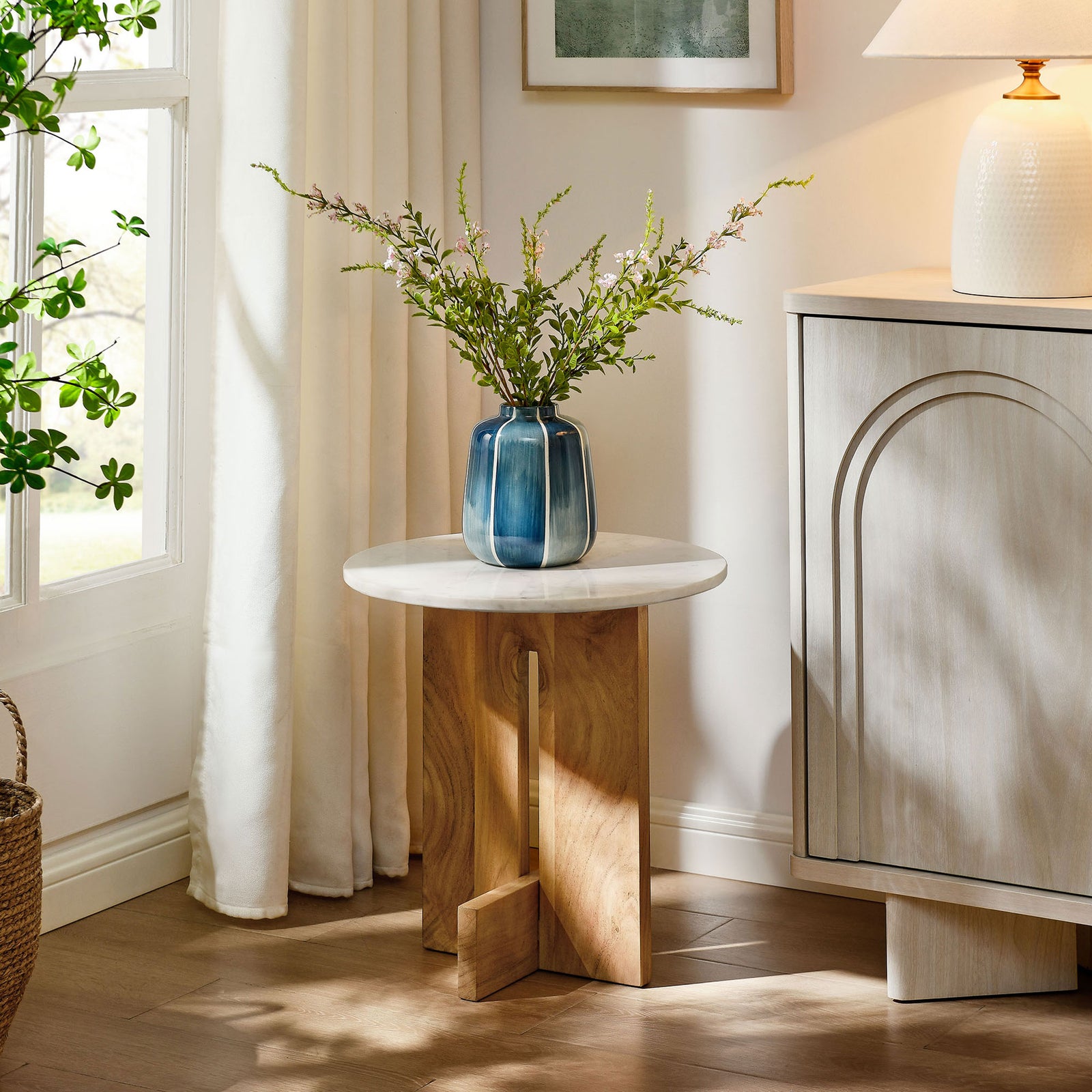 Versatile marble and wood side table styled with decor to complement modern living spaces || EEI-7141-NAT || side_room