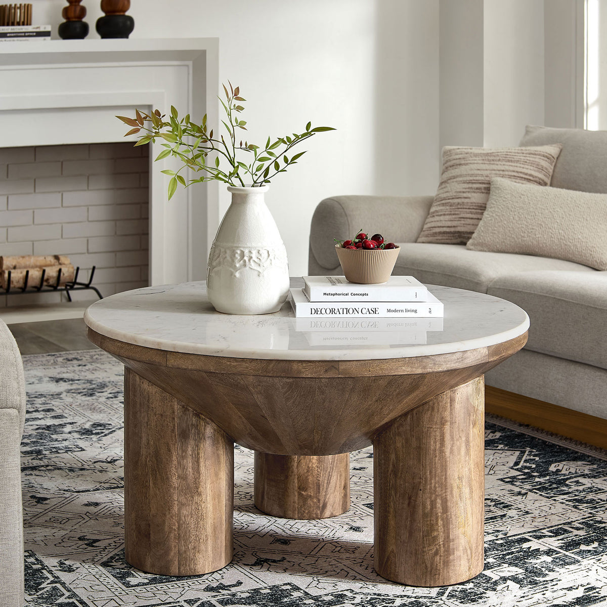Statement round coffee table pairs warm mango wood with a cool marble top for effortless sophistication. || EEI-7146-WAL || front_angle_room