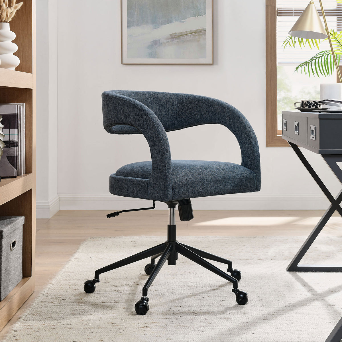 Barrel back office chair adding tailored comfort to a contemporary home workspace. || EEI-7149-SLB || front_angle_room