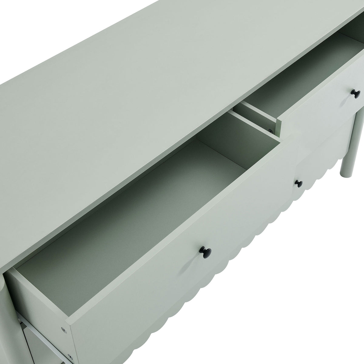 Top drawers pulled open to showcase organized storage space inside the scalloped sage green dresser. || EEI-7157-SGE || storage_open_studio