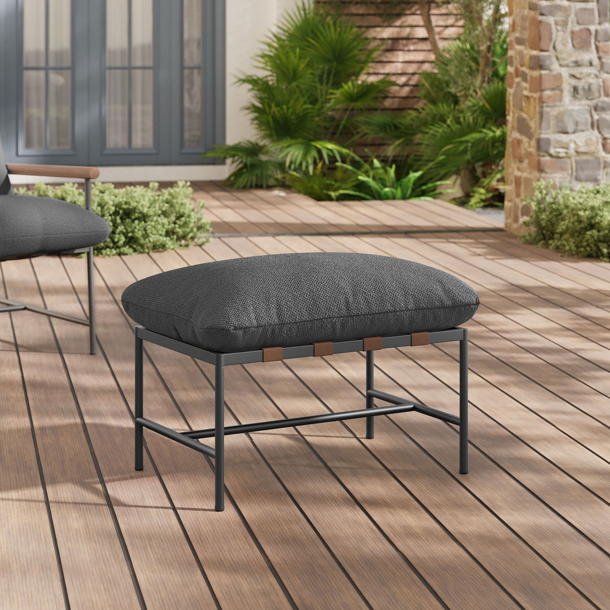 Charcoal boucle outdoor ottoman styled on a sunlit deck with matching lounge seating in the background || EEI-7161-CHA || front_angle_room