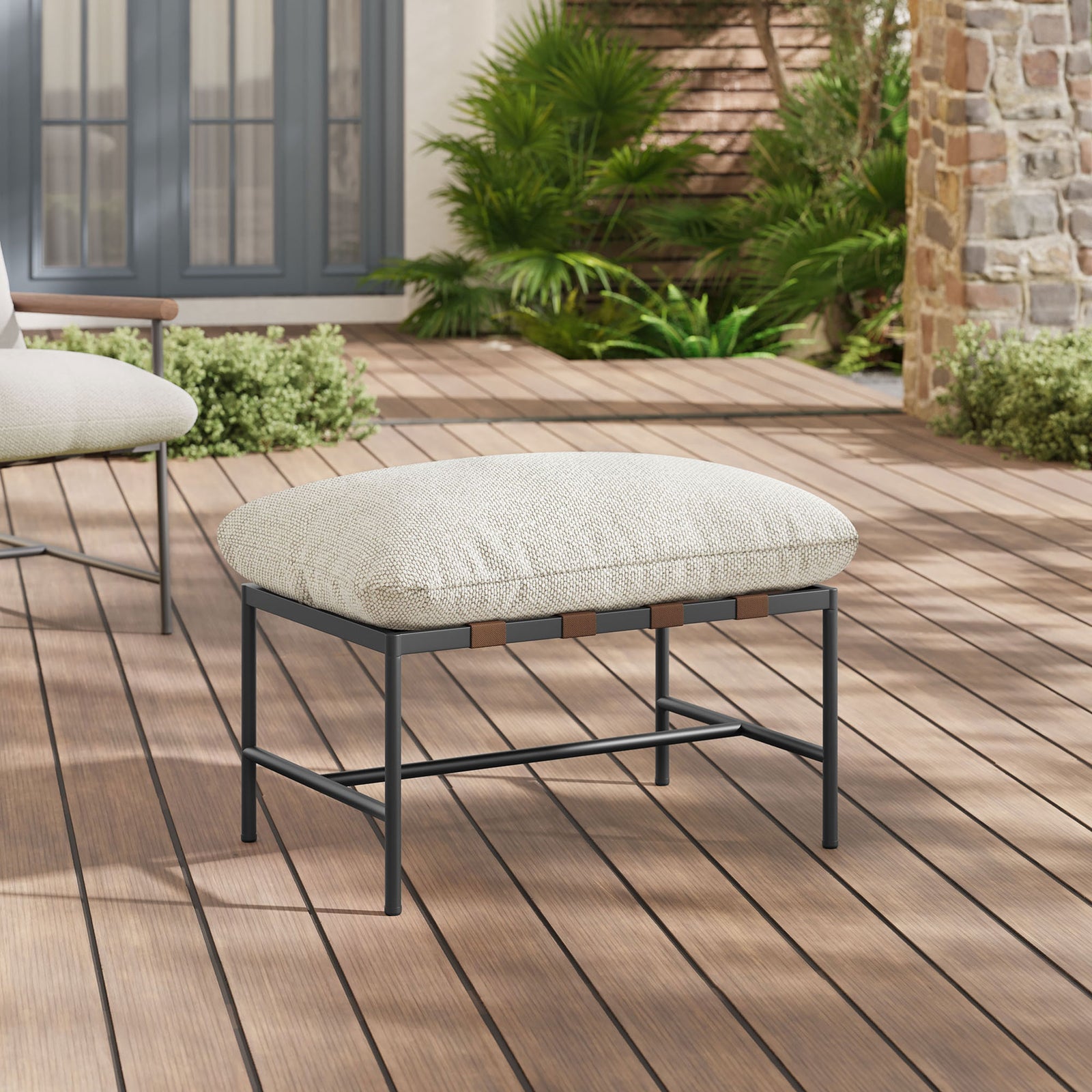 Ivory boucle outdoor ottoman styled on a sunny deck with coordinating lounge seating nearby || EEI-7161-IVO || front_angle_room