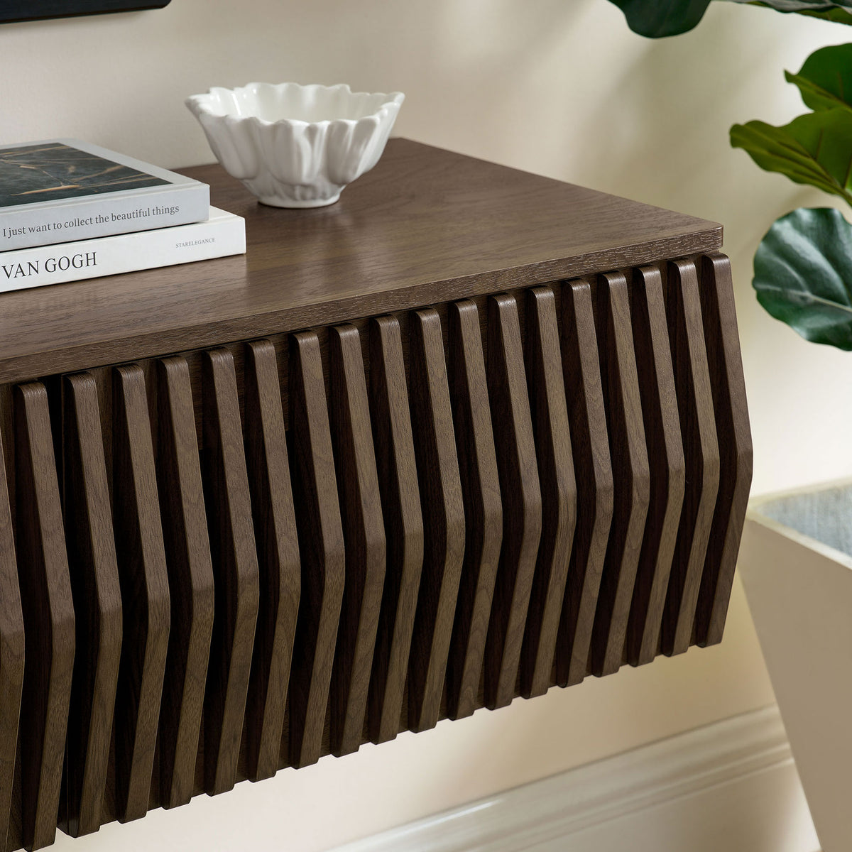 Walnut TV cabinet top decorated with books and decor to complement the slatted front || EEI-7164-WAL || detail_room