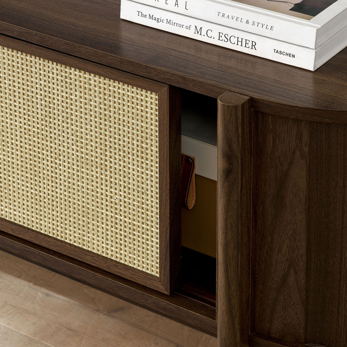 Sliding rattan door revealing hidden storage for books, games, and media accessories || EEI-7165-WAL || storage_open_room