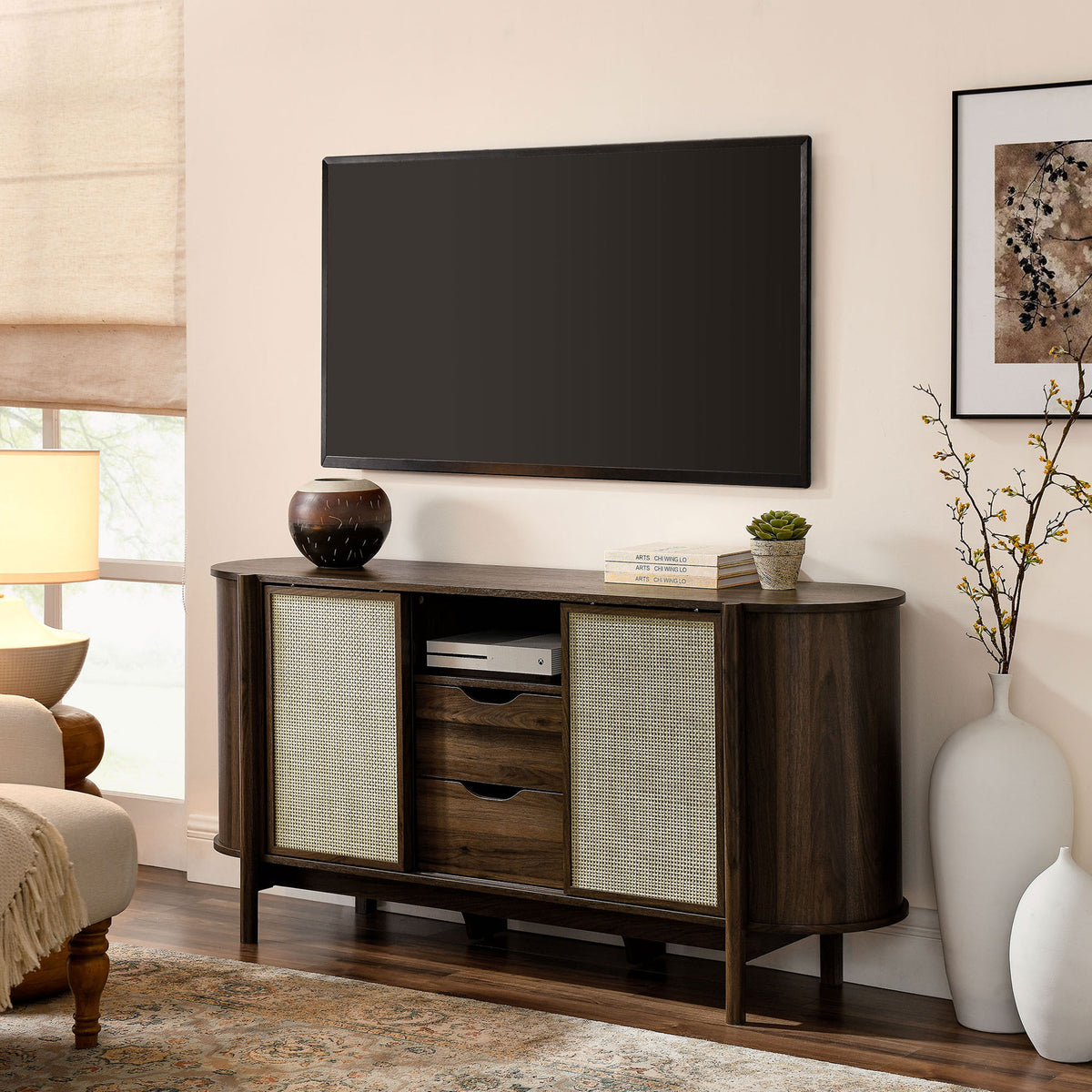 Walnut sideboard doubles as a TV console, anchoring the living room with warm modern style || EEI-7166-WAL || front_angle_room