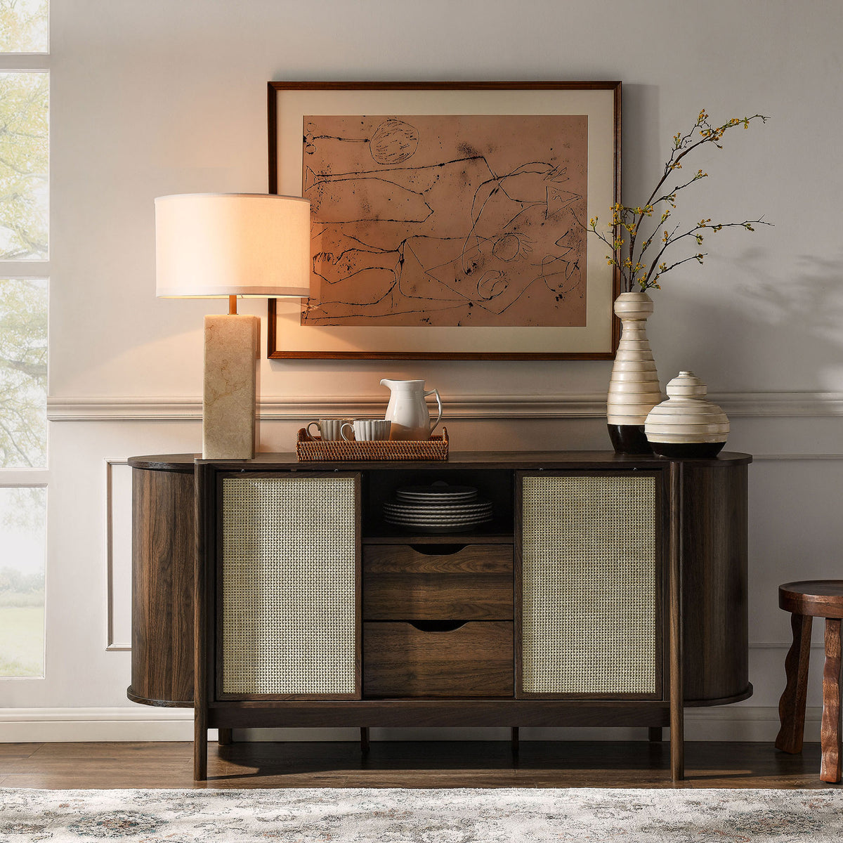 Curved walnut sideboard styled with decor accents, adding texture and storage to the entry or dining room || EEI-7166-WAL || front_room