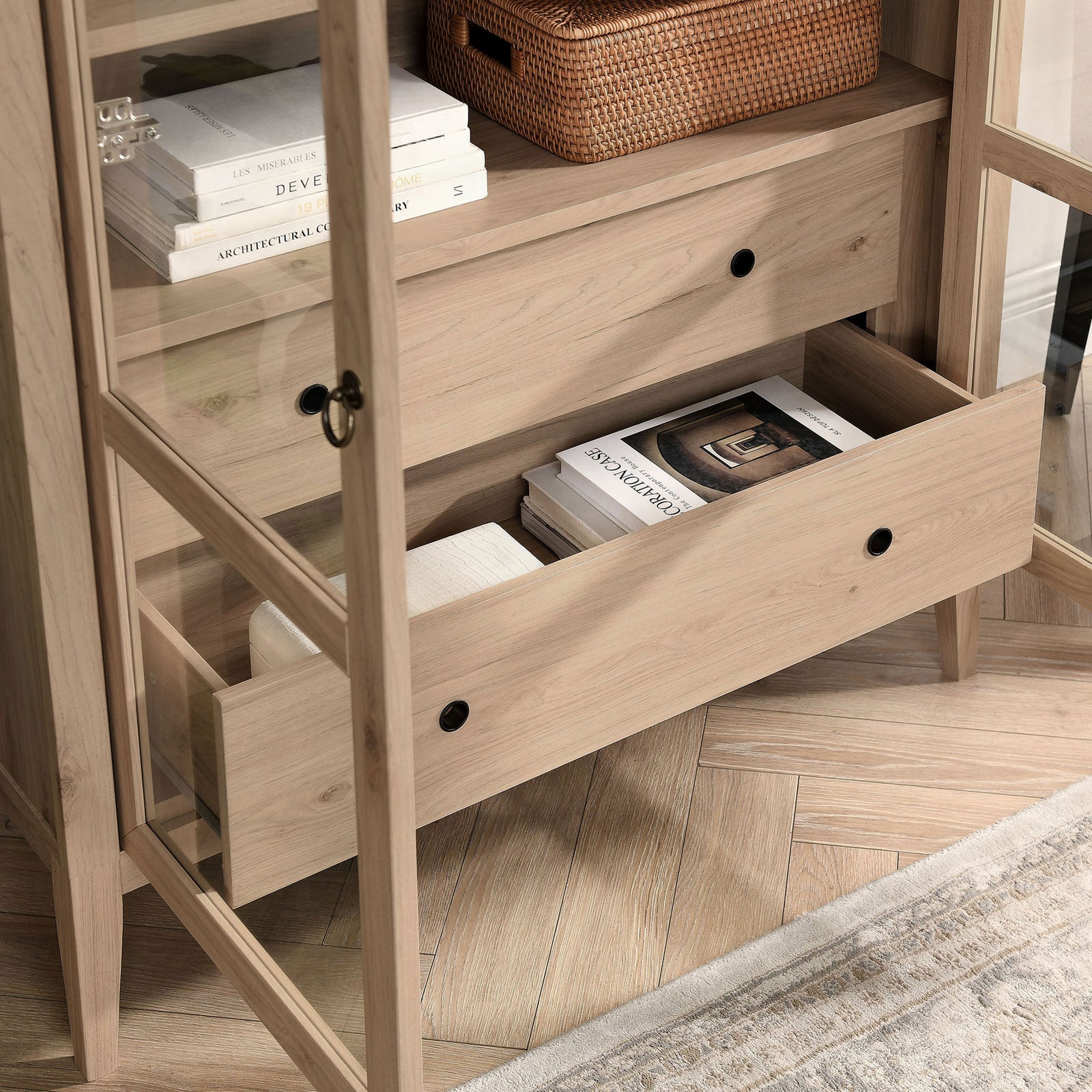 Lower drawer of the light oak cabinet holding books, throws, and everyday accents || EEI-7168-LOA || storage_open_room