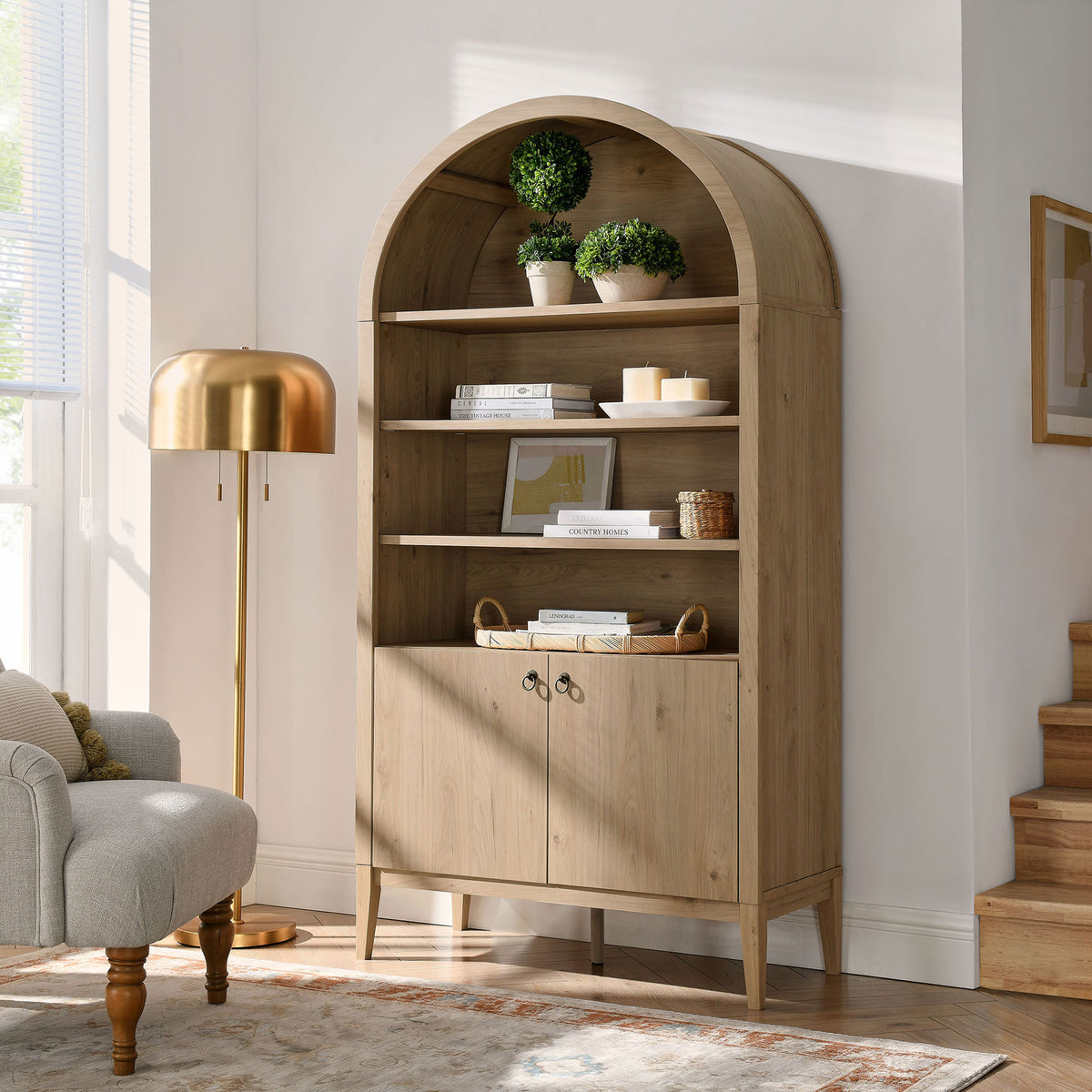 Light oak finish warms the room with generous shelving and hidden storage || EEI-7169-LOA || front_angle_room