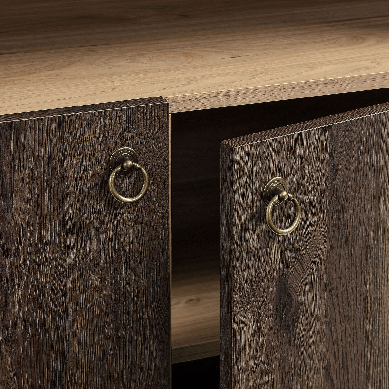 Brushed gold ring pulls bring a classic, refined touch to the dark walnut doors || EEI-7169-WAL-LOA || handle_studio