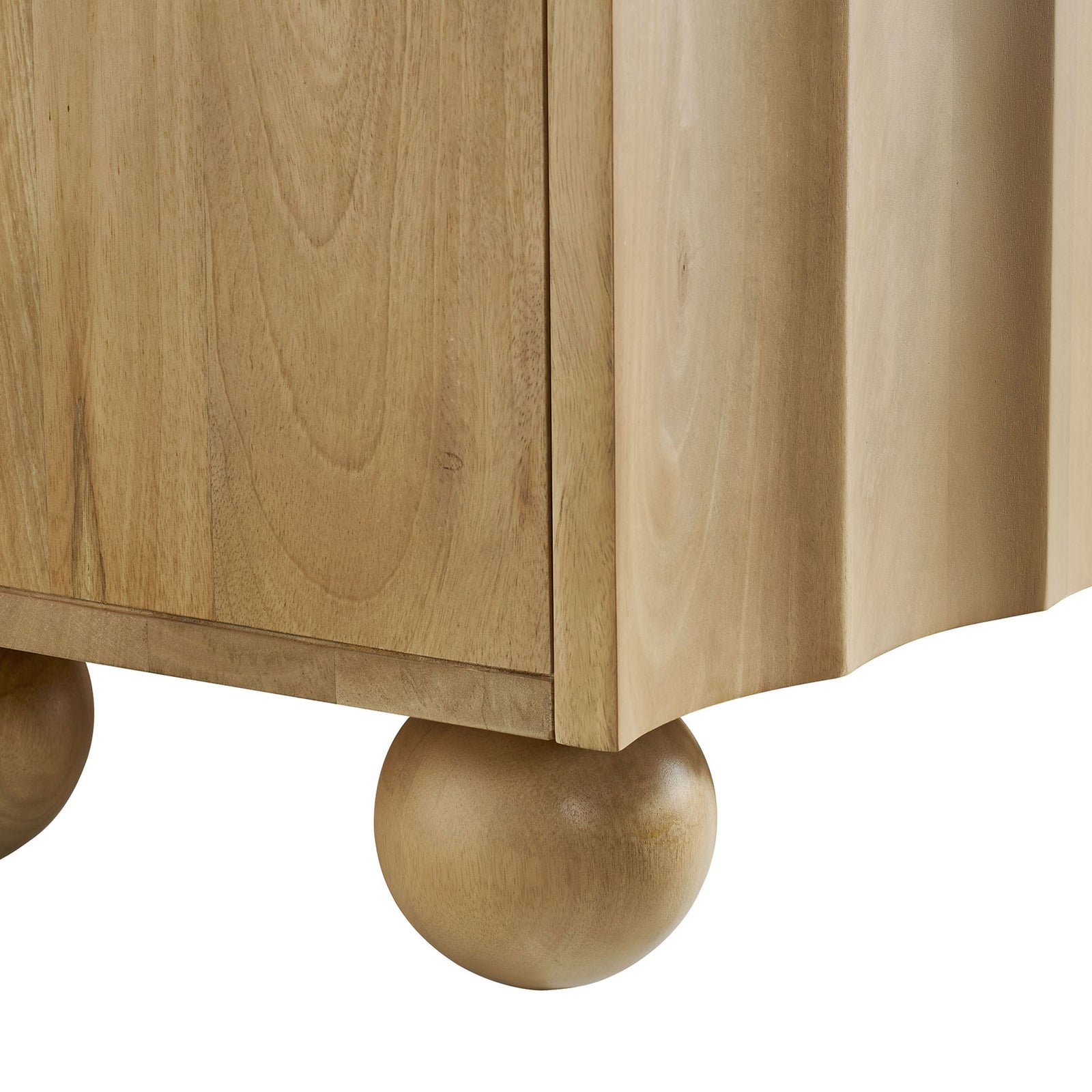 Rounded bun foot and lower edge detail of the natural wood TV stand showing soft curves and grain || EEI-7184-NAT || leg_studio