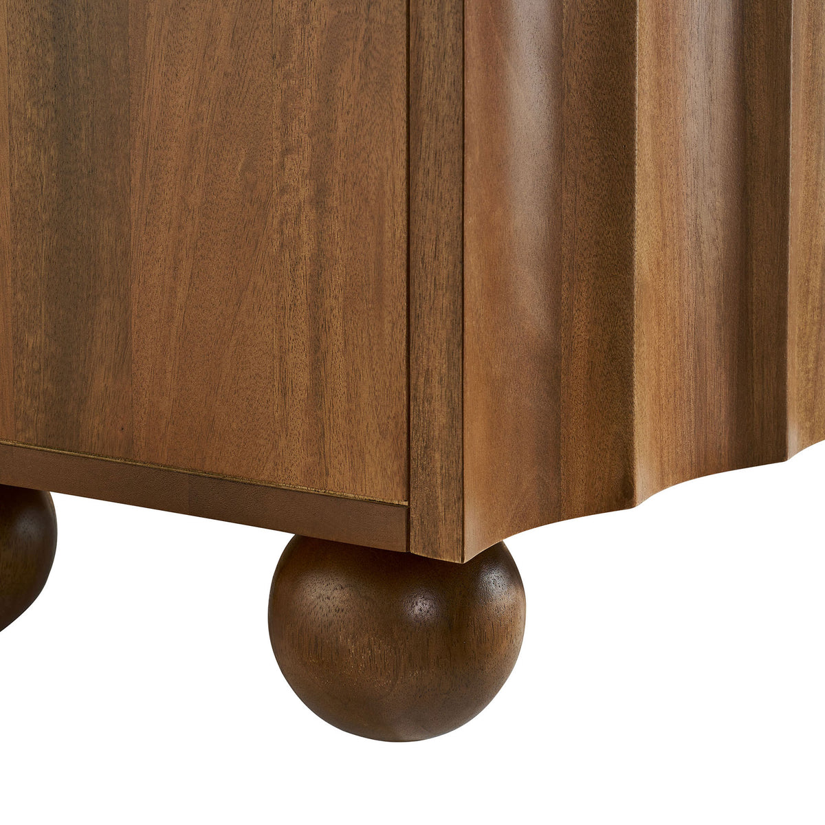 Rounded bun foot detail of the walnut TV stand showcasing curved form and natural wood grain || EEI-7184-WAL || leg_studio
