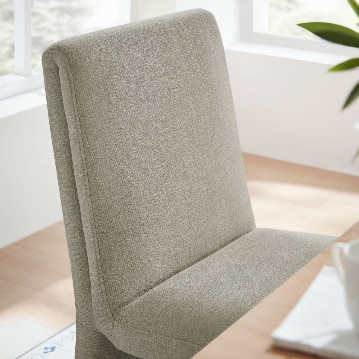 Textured linen upholstery and plush foam seat bring inviting comfort to the dining space || EEI-7185-LIN || detail_room